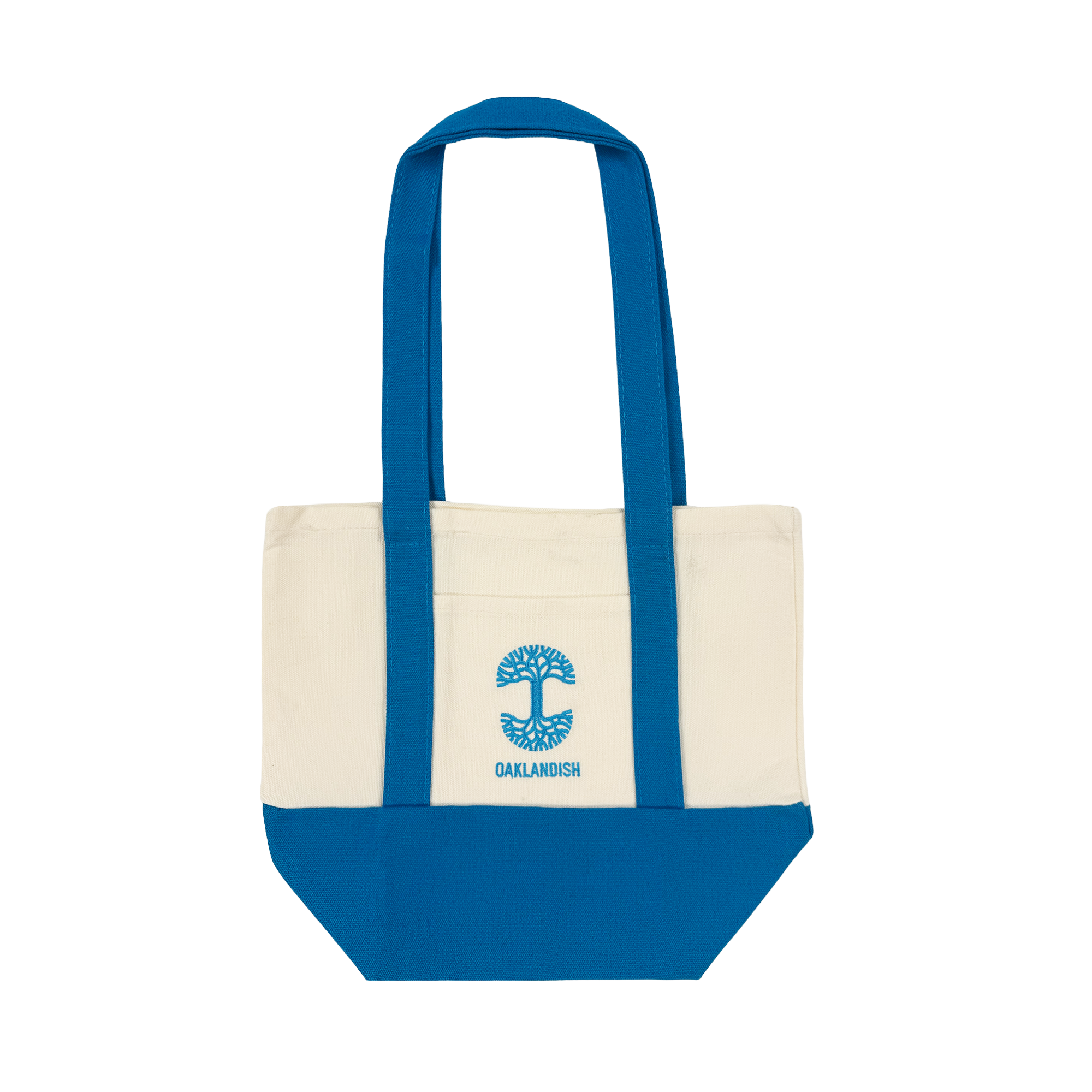 The Oaklandish Mini Grocery Tote features a cream upper, bright blue bottom, handles, and trim. Centered on the front is an embroidered blue tree logo above "OAKLANDISH." Spacious main compartment stores your essentials.