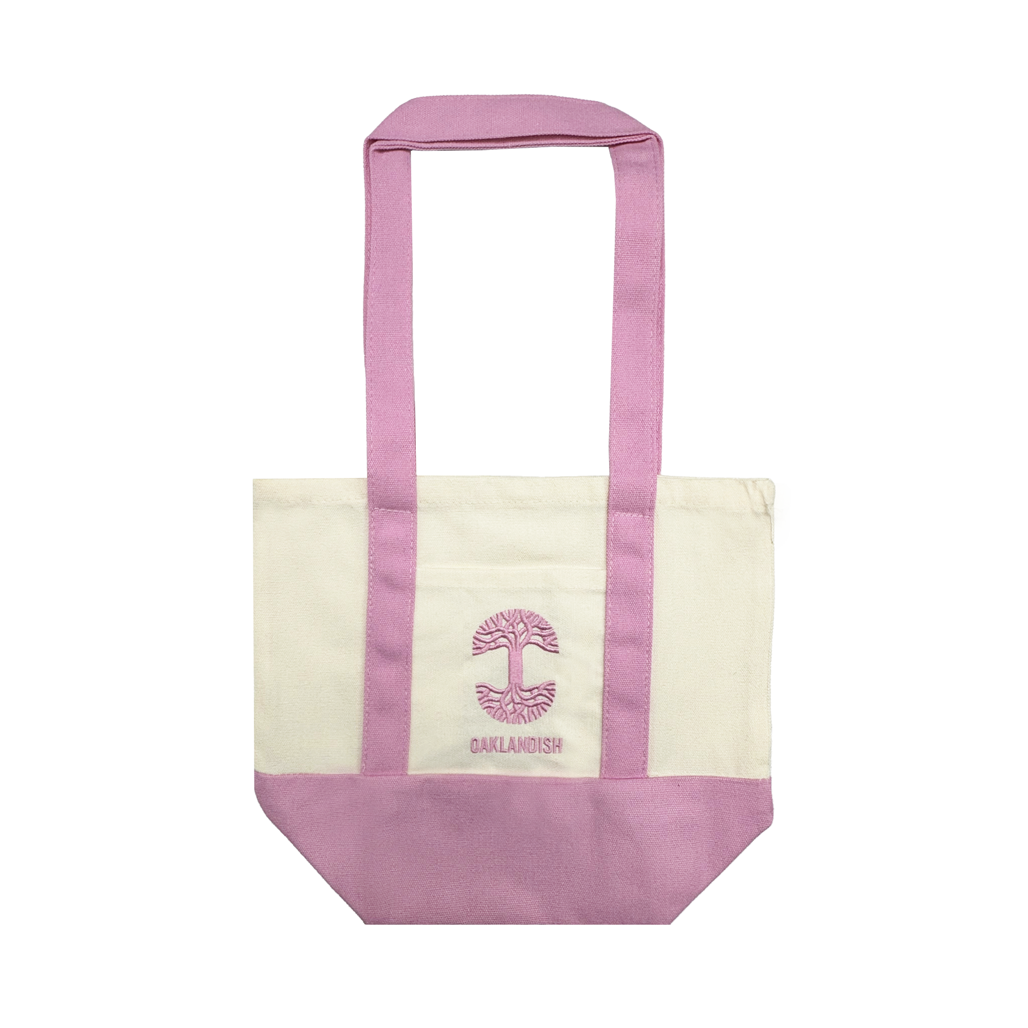 The Oaklandish Mini Grocery Tote by Oaklandish features pale pink handles and base, a cream body, and a pink stylized tree logo with “OAKLANDISH” printed below. The background is plain white.