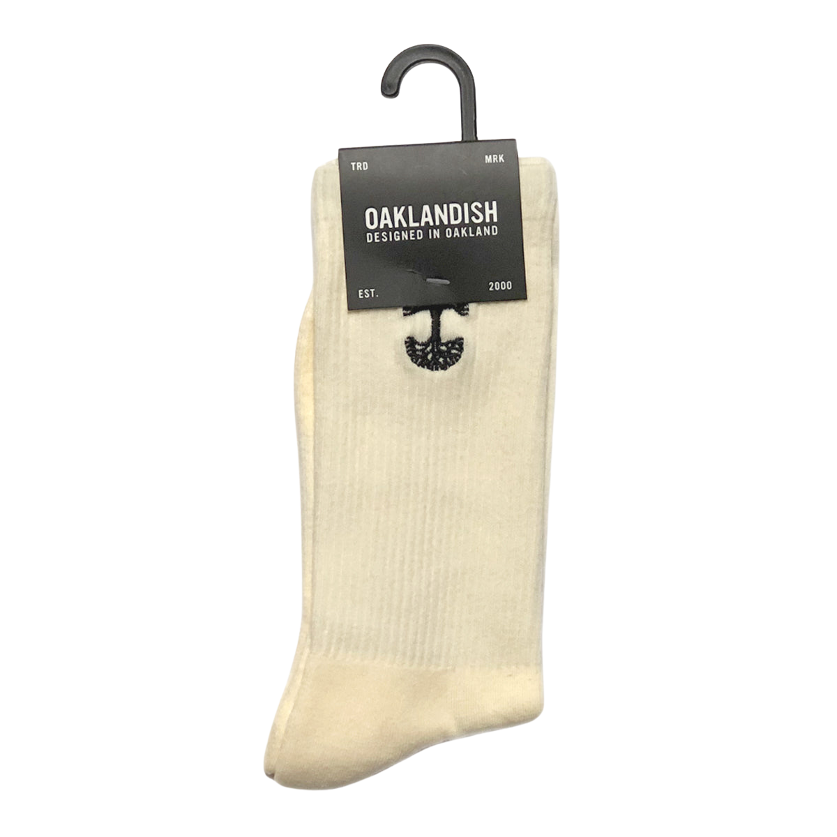 A pair of yellow cotton Embroidered Logo Socks is displayed against a plain background. Neatly folded and held together by a black hanger, they feature an embroidered logo. Attached to the hanger is a dark gray label reading "Oaklandish, Designed in Oakland," accompanied by an image of an oak tree. The label also notes "TRD MRK" and "EST. 2000".