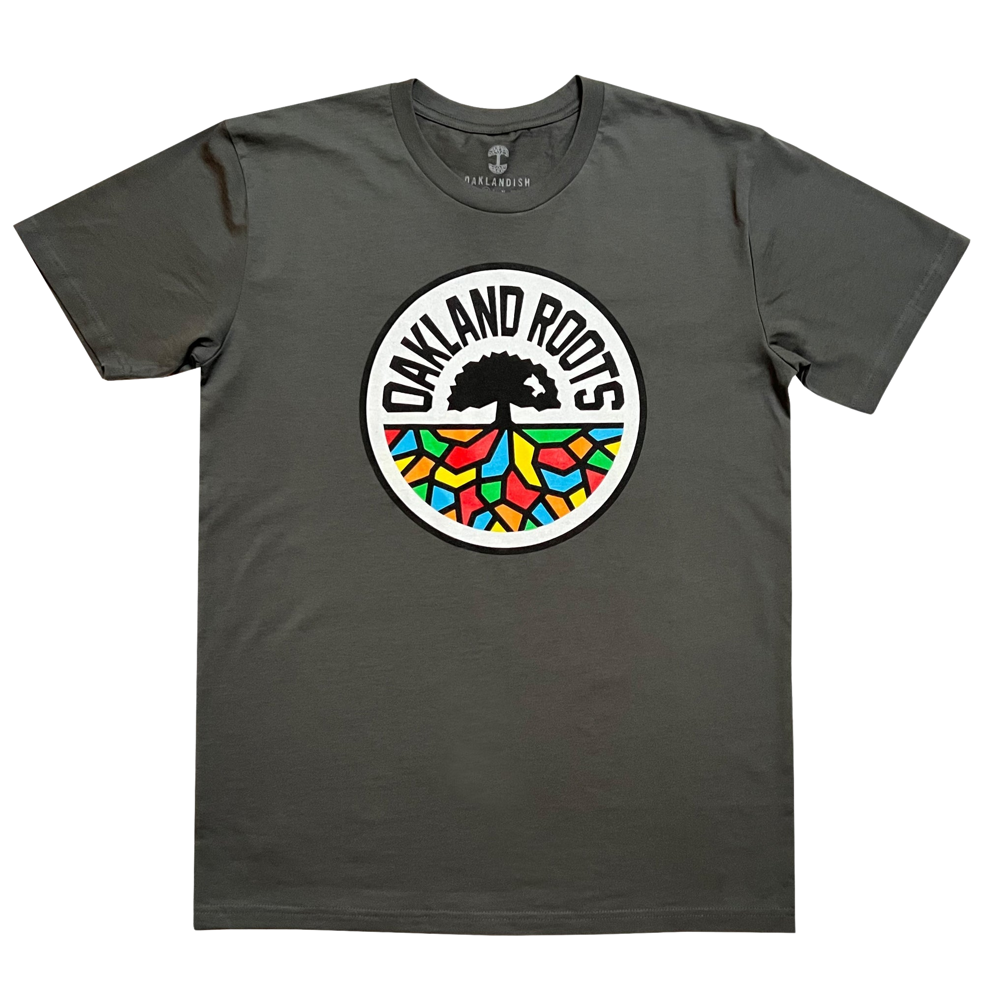 Introducing the Oakland Roots SC Classic Tee by Oakland Roots SC: a charcoal gray T-shirt prominently featuring the "Oakland Roots" logo at its center. The logo, inspired by the Oaklandish aesthetic, showcases a tree with extensive roots forming vibrant mosaic-like patterns in shades of red, blue, green, yellow, and orange. The text "OAKLAND ROOTS" elegantly arches over the tree and its colorful roots.