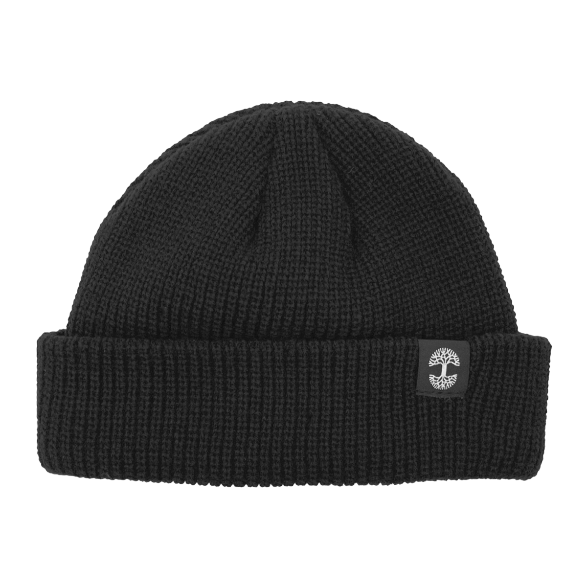 The Ramos Beanie by Oaklandish is a black knit beanie featuring a folded cuff. The cuff showcases an embroidered logo of a white tree inside a gray circular border. Made from woven acrylic, the knit pattern's texture is clearly visible, contributing to its cozy and warm appearance.