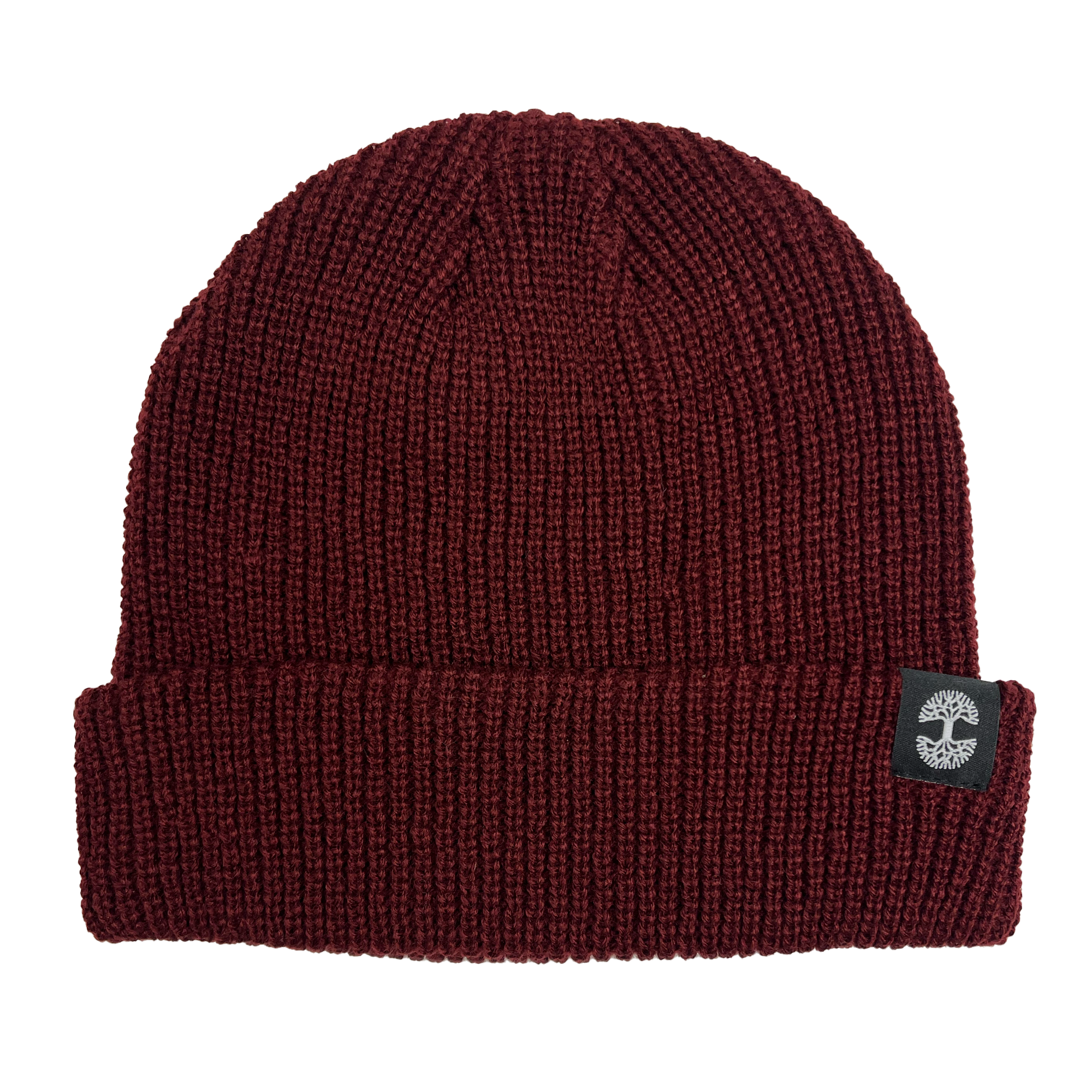 The Ramos Beanie by Oaklandish is a maroon acrylic headwear featuring a ribbed texture and folded brim. It includes a black fabric tag on the brim adorned with a white circular logo, providing cozy style and warmth for cold weather.