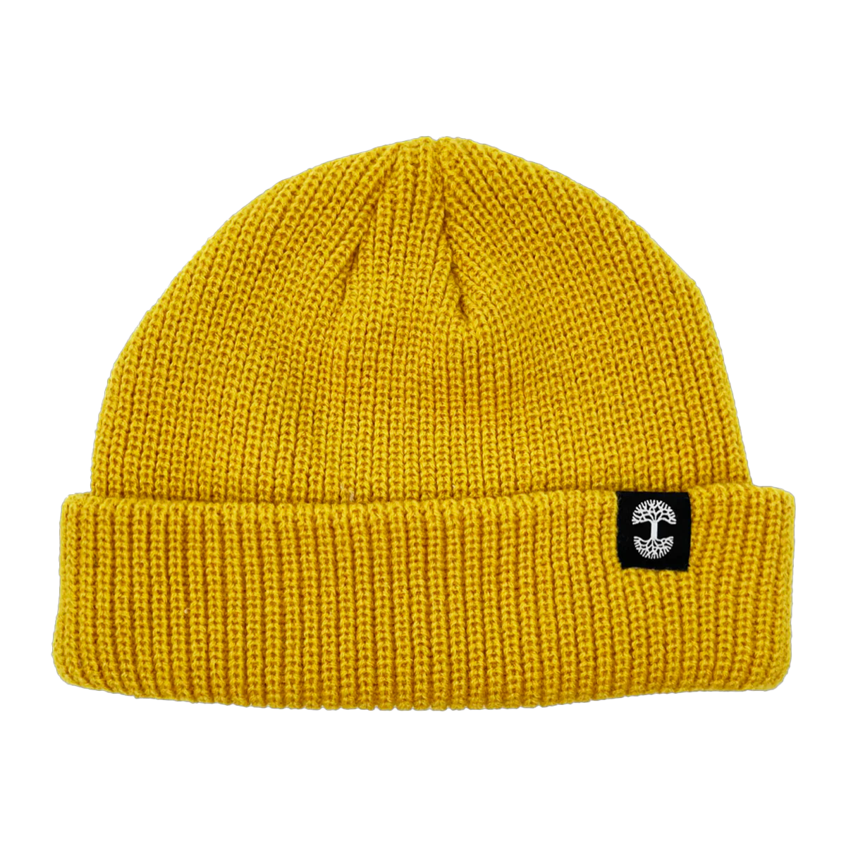 The Ramos Beanie by Oaklandish is a bright yellow knitted beanie made from woven acrylic with a folded brim. The brim features a small black patch with a white mushroom design on the front. The beanie has a ribbed texture and appears soft and warm, making it ideal headwear for cold weather.