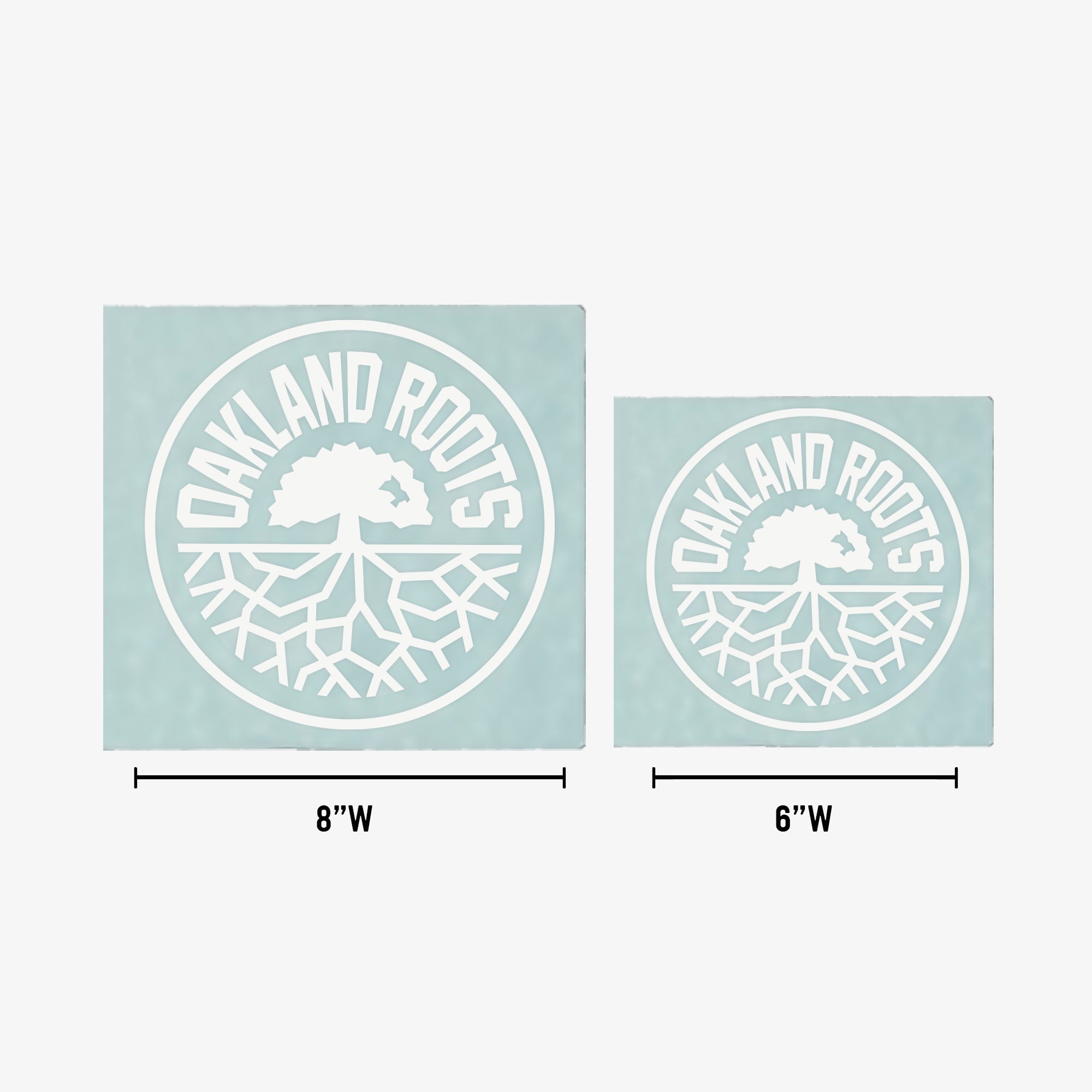 On a light blue background, two Oakland Roots SC logos showcase a tree with roots in a circular design. The larger logo on the left measures 8 inches wide, while the right one, named "Oakland Roots SC Decal - 6"" from Oakland Roots SC brand, measures 6 inches wide. The words "OAKLAND ROOTS" arc above the tree in both logos. These window decal stickers are perfect for any sports club enthusiast.