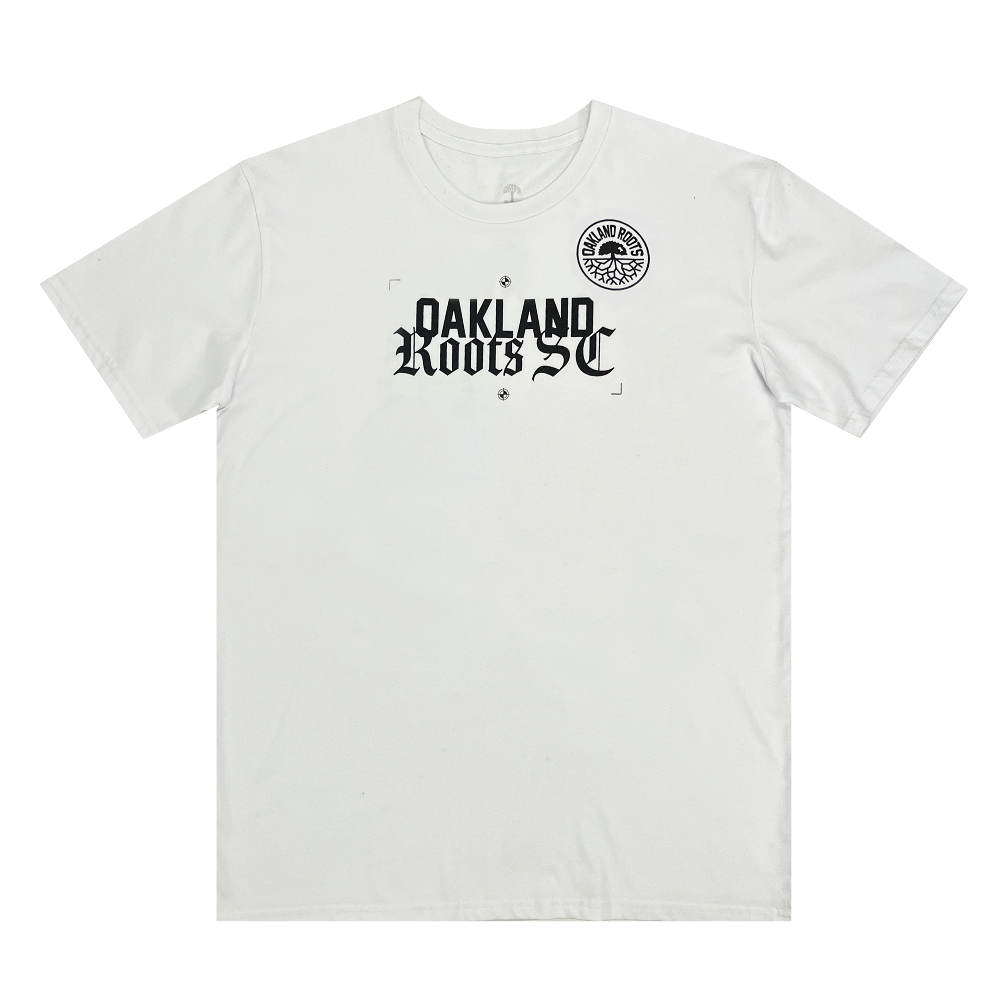 The Oakland Roots SC Futbol Town Tee is a white T-shirt that showcases black text and graphics. The bold, stylized font on the chest prominently displays "Oakland Roots SC," and above it sits a circular emblem with intricate black detailing, resembling a tree with roots spreading outward in radial symmetry—proudly representing the Oakland Sports Club.