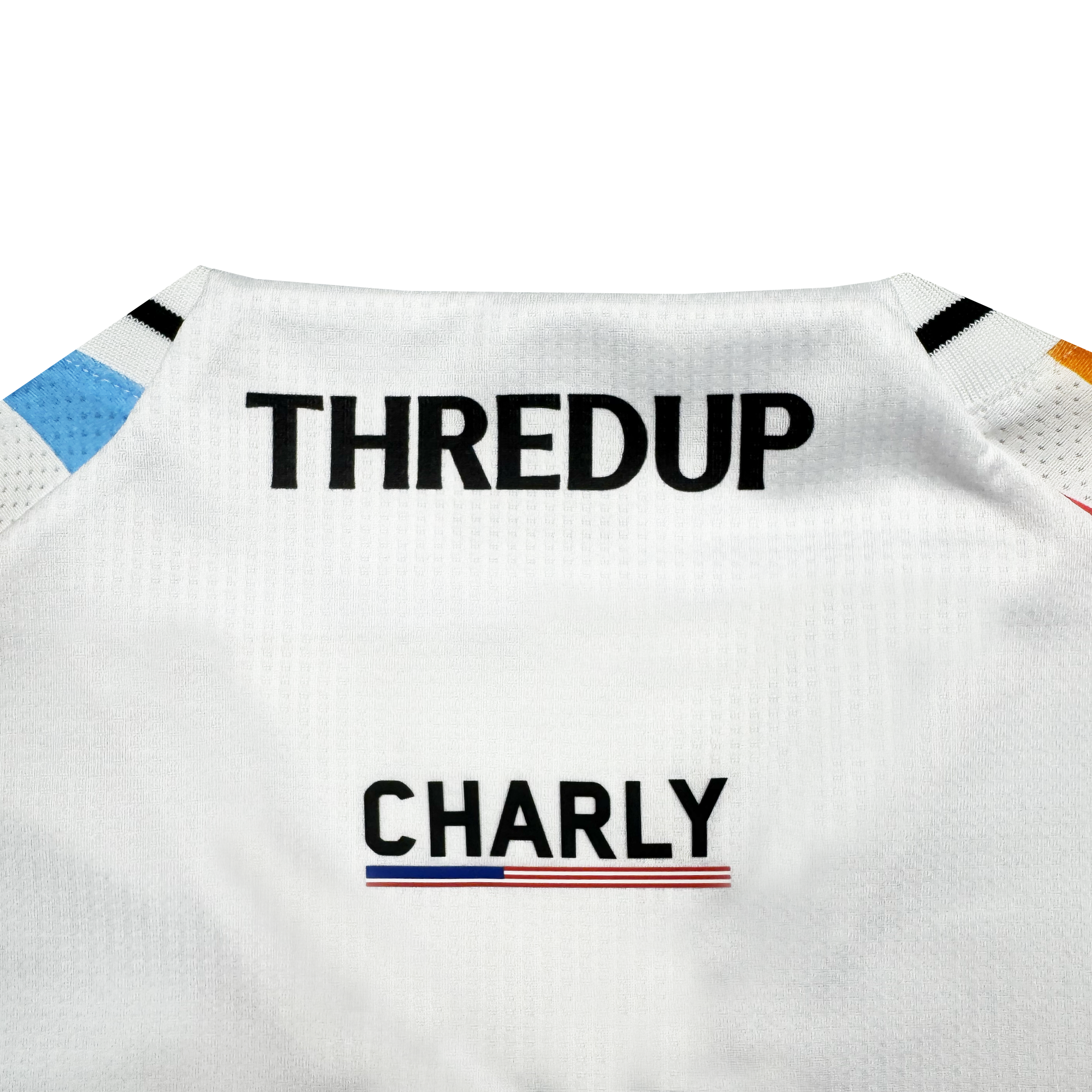 Close-up of the Unisex Mosaic in Motion Kit by Oakland Roots SC. "THREDUP" is bold on the upper back, "CHARLY" below, with a thin tricolor line and small colored accents on the shoulders, previewing the 2026 Oakland Roots kit.