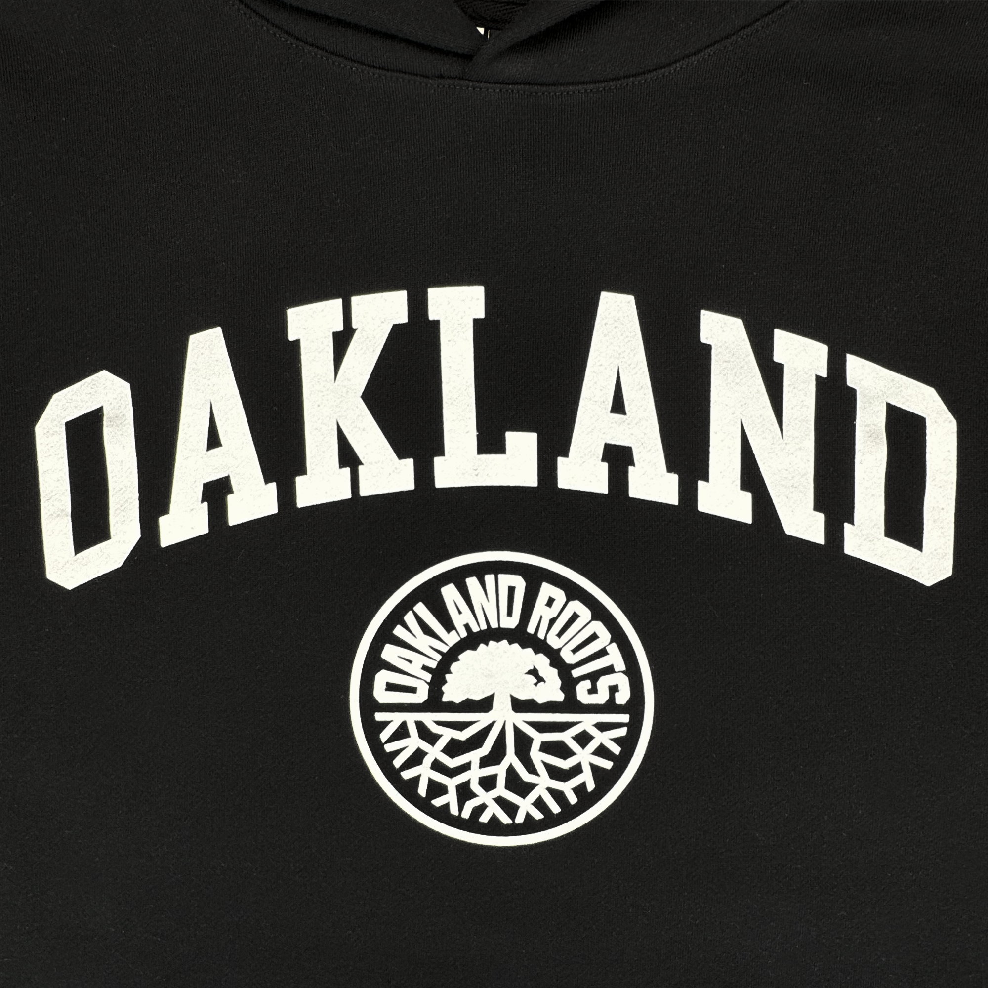 The Oakland Roots SC University Hoodie by Oakland Roots SC is a men's black pullover with "OAKLAND" in bold white letters above the circular "OAKLAND ROOTS" tree logo—perfect for Roots SC fans or those who love Oaklandish styles.