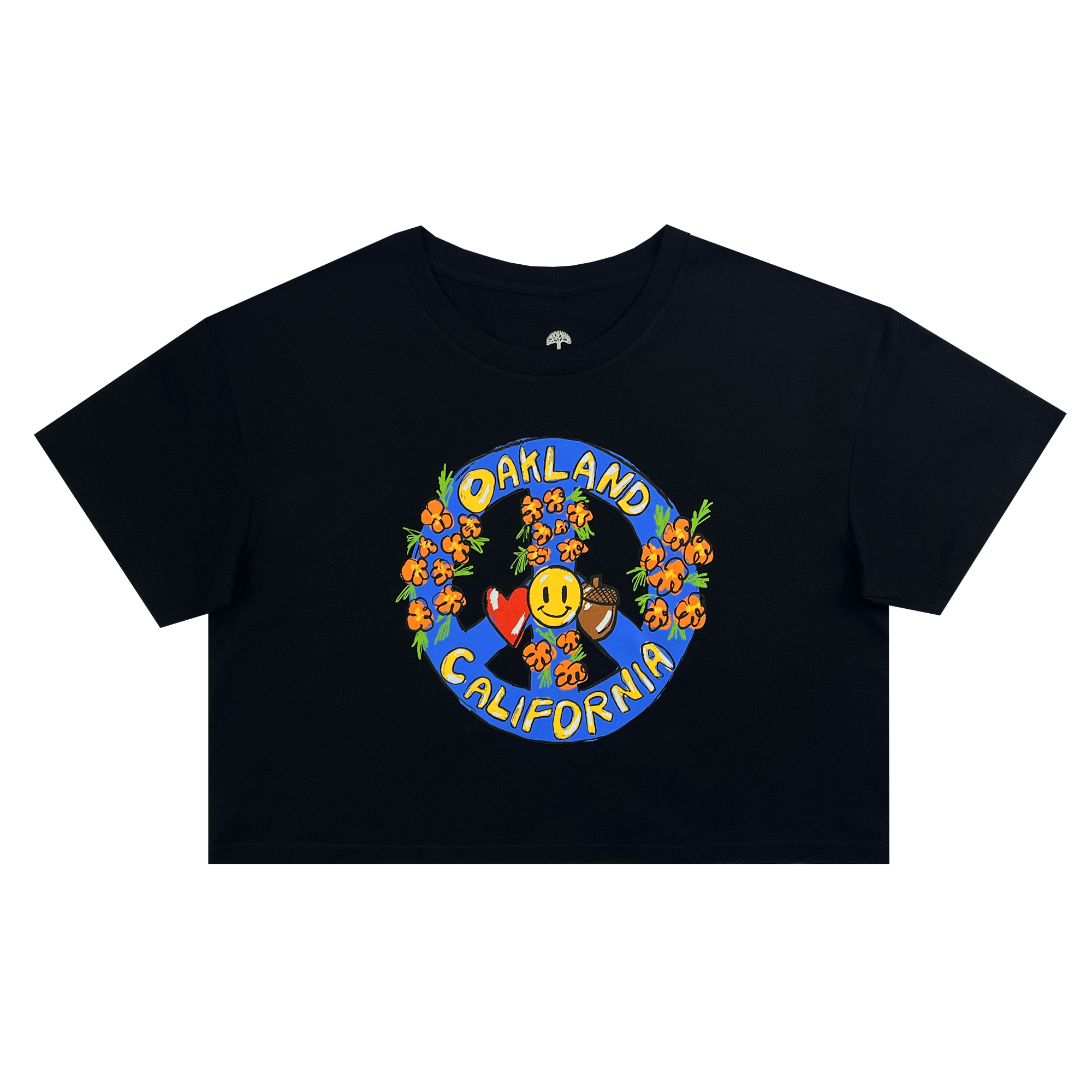 The Women's Smile Crop Tee by Oaklandish is a black, short-sleeve, 100% cotton t-shirt with a graphic design on the front. The design showcases "OAKLAND CALIFORNIA" in yellow letters surrounding a smiling face with a hat, all surrounded by colorful flowers and leaves set against a blue background. Available in women's sizing.