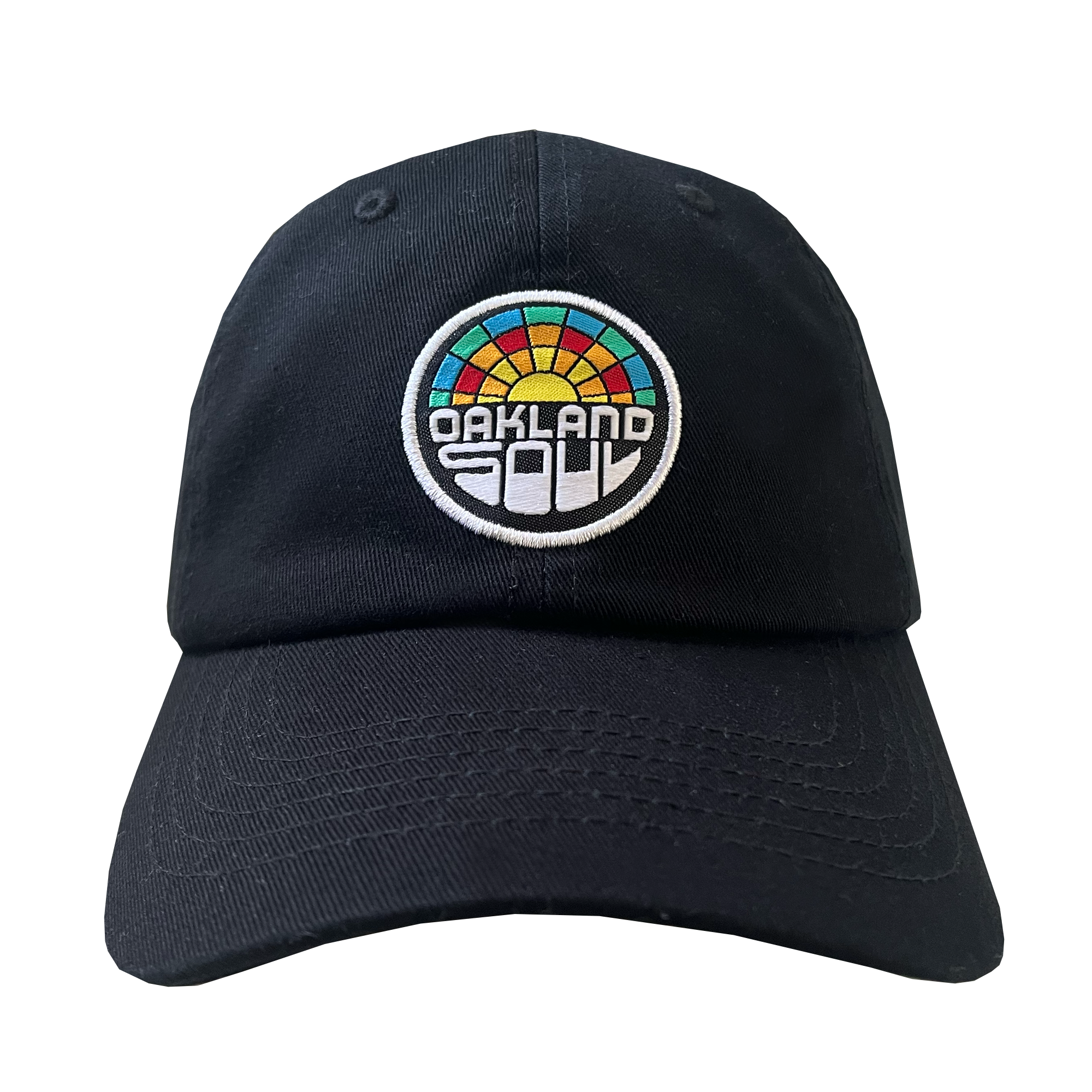 The Oakland Soul Dad Hat is a black baseball cap featuring a circular, multicolored patch centered on the front. The patch showcases a stylized sunset design in shades of red, orange, yellow, green, and teal with the text "OAKLAND SOUL" in bold white letters beneath it—a perfect tribute to your favorite women's soccer team in the USL W-League.