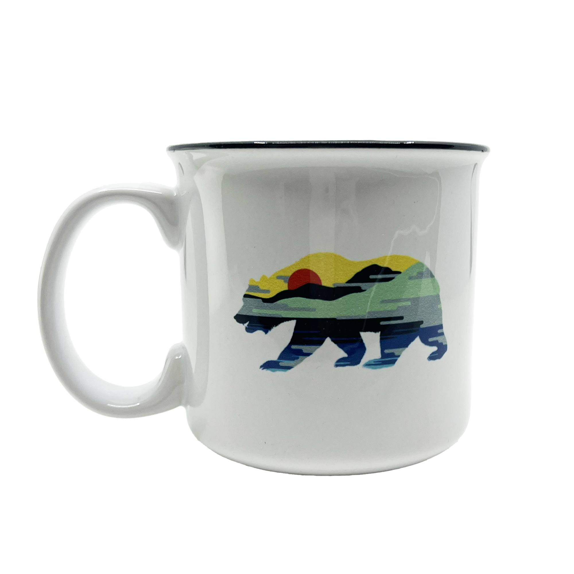 Introducing the Sunset Bear Coffee Mug by Oaklandish, a white ceramic mug adorned with a vibrant California grizzly design. The bear is filled with a captivating landscape scene featuring a red sun, green and yellow hills, and a blue sky. It is elegantly accented with a black rim and sturdy handle against its plain white background.