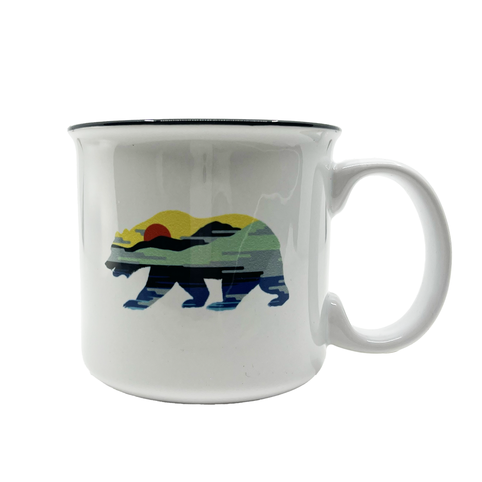 The Sunset Bear Coffee Mug by Oaklandish is a white ceramic mug with a thick black rim, showcasing a graphic of a California grizzly bear filled with a landscape design. The design features a serene outdoor scene with layers of hills and water bathed in the colors of a colorful sunset, including shades of green, yellow, orange, and blue.