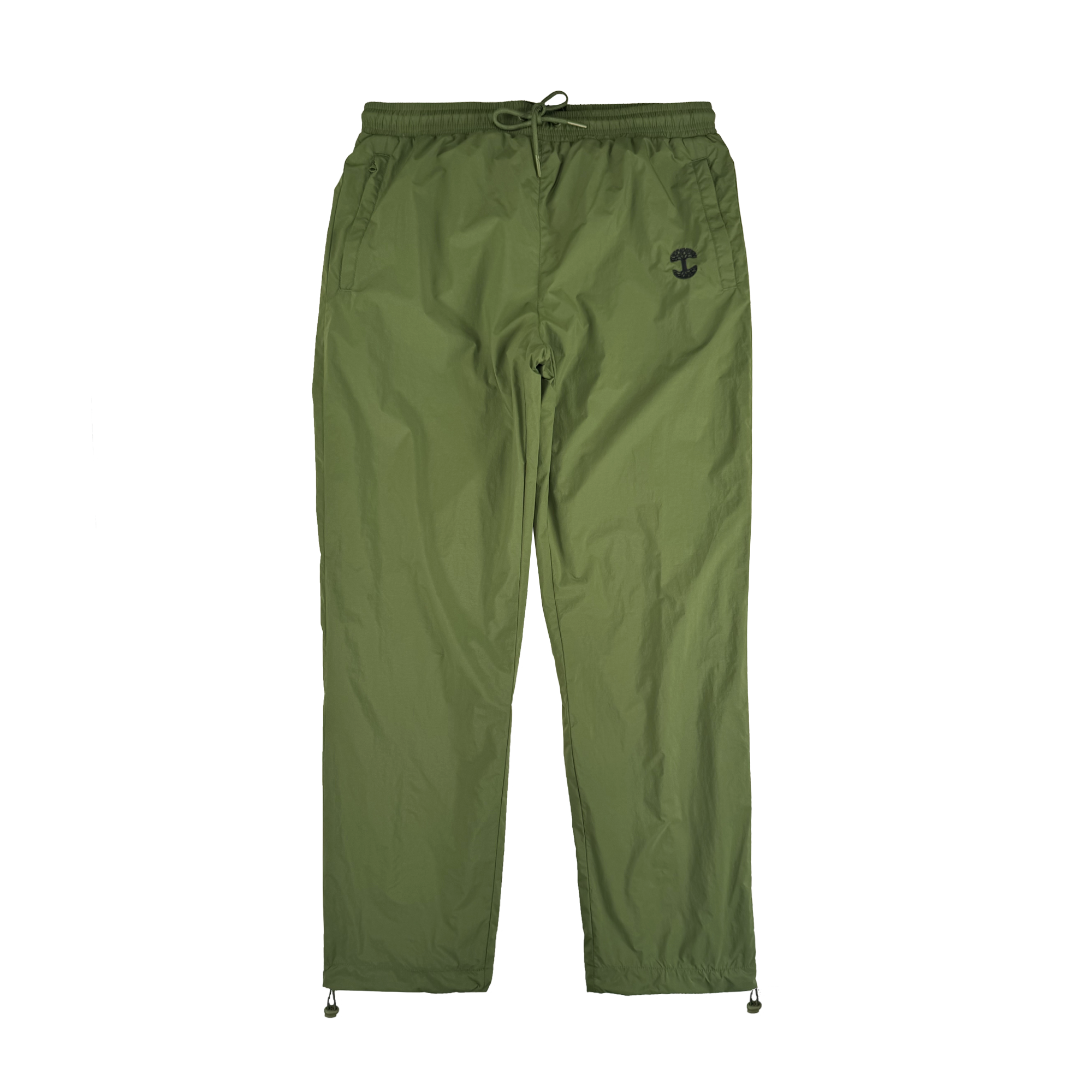 The Oaklandish Susurrus Track Bottom is an olive green jogger-style nylon pant with an adjustable waistband, drawstring closure, side pockets, ankle drawstrings, and a black army-inspired logo on the upper left thigh. Laid flat on a white background.