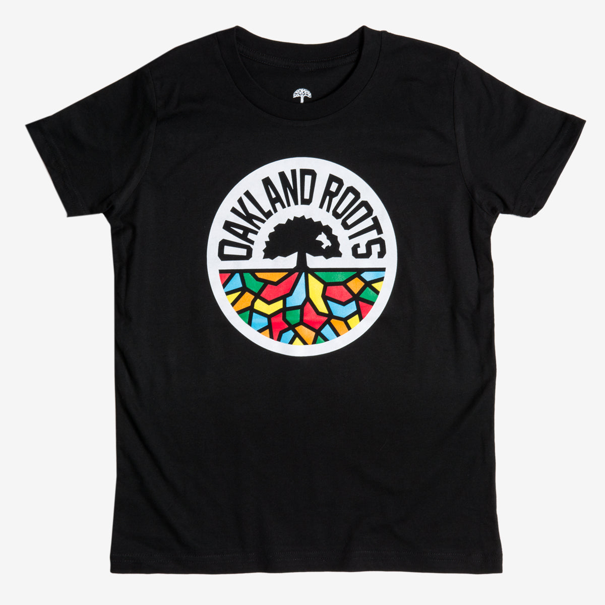 Youth Oakland Roots SC Classic Tee in black, featuring a central circular logo with the words "OAKLAND ROOTS." The logo, inspired by Oaklandish artistry, showcases an abstract tree with roots extending into a vibrant mosaic pattern in red, yellow, blue, and green. Ideal for fans of Oakland Roots Sports Club.