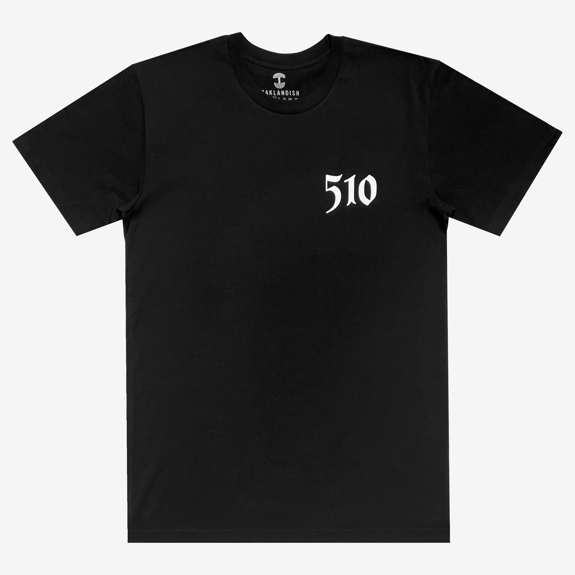 A black classic fit T-shirt, known as the Sistrurus Tee, features a small, white, stylized "510" text on the left side of the chest. This 100% cotton shirt by Oaklandish has a round neck and short sleeves. The brand's logo, "Oaklandish," is visible on the inner neckline tag. The shirt is displayed flat against a light gray background.
